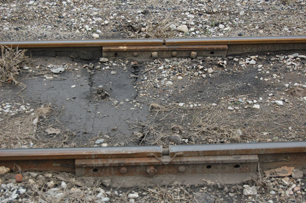 Two railroad track joint bars side-by-side.